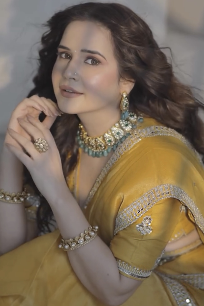 Shiv Shakti In Marigold Yellow Tissue Draped Saree Set